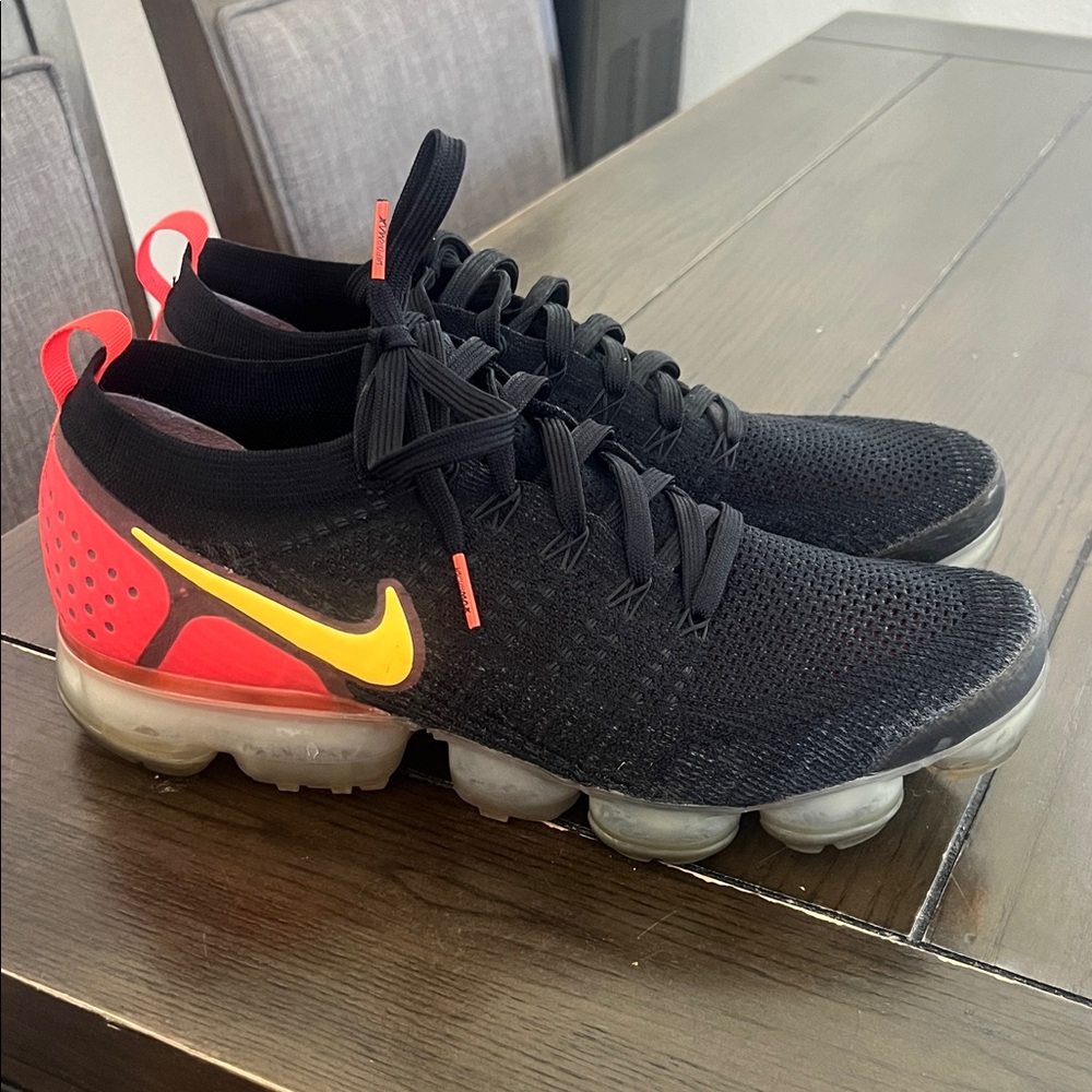 Nike Black Flyknit Sneakers with Yellow Swoosh & Red Heel